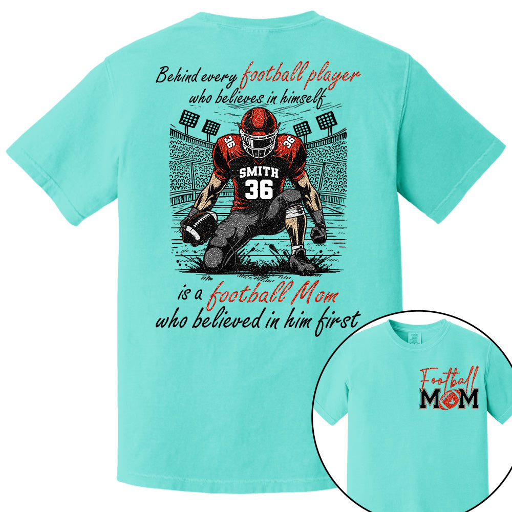 Behind Every Football Player Who Believes In Himself Is A Football Mom Who Believed In Him First, Football Mom Tshirt -TD22