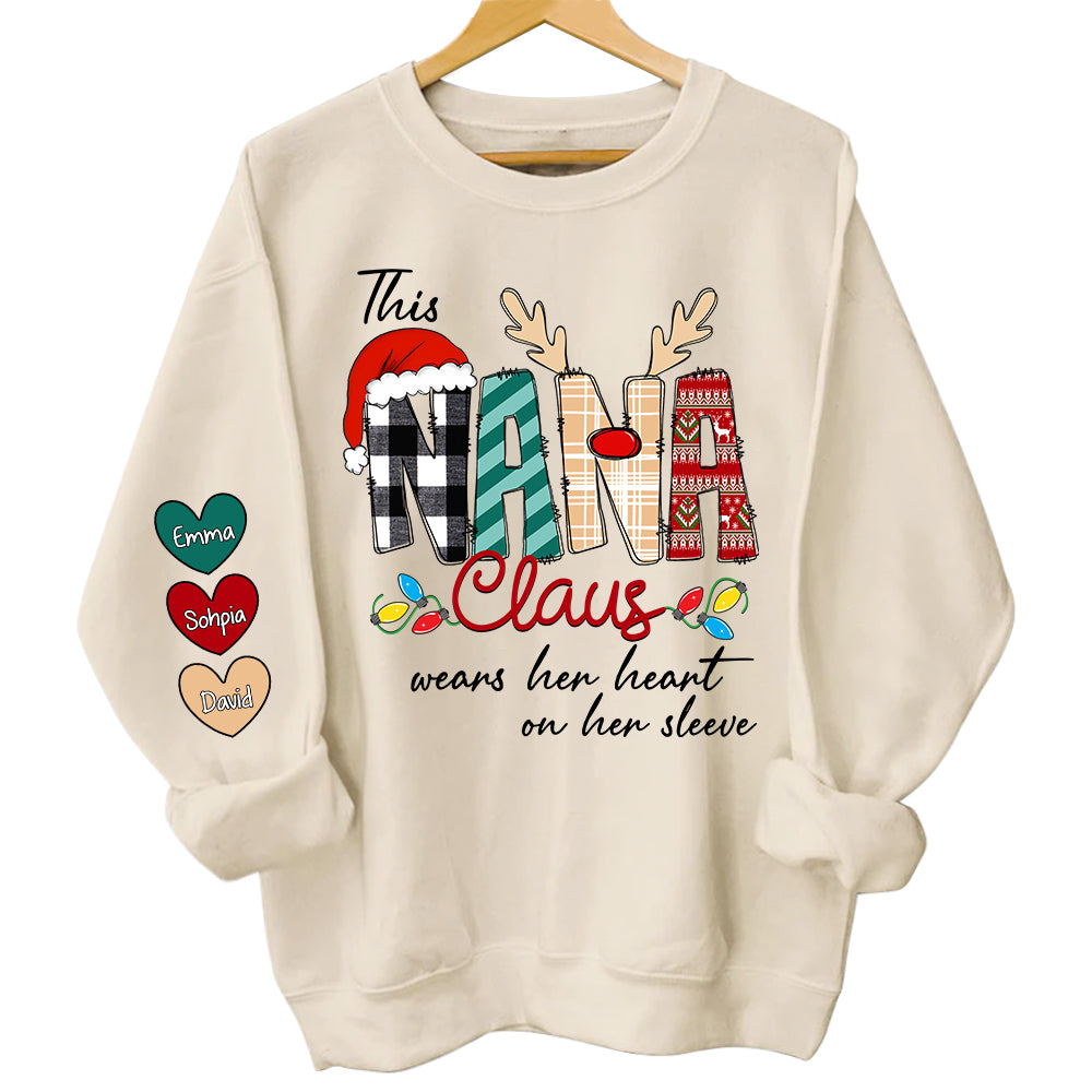 This Nana Claus Wears Her Heart On Her Sleeve - Personalized Grandma With Grandkids Name Shirt