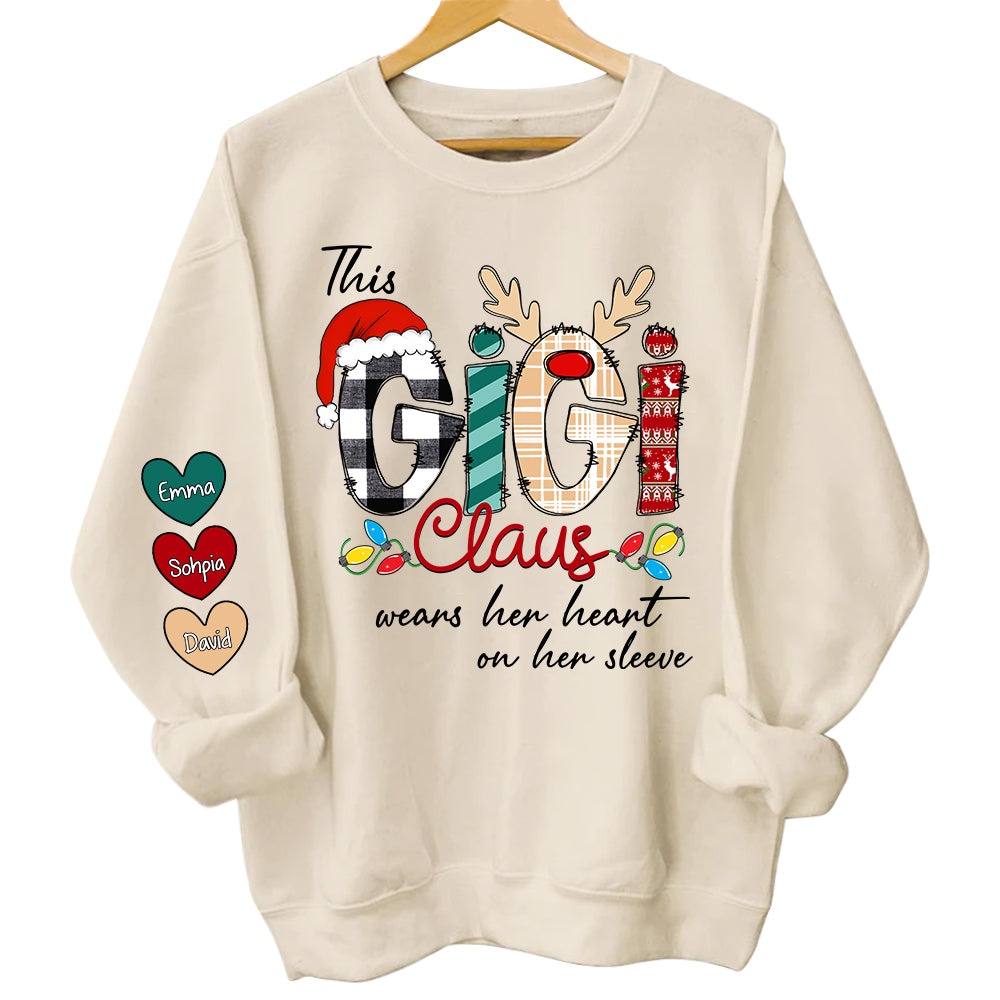 This Gigi Claus Wears Her Heart On Her Sleeve - Personalized Grandma With Grandkids Name Shirt